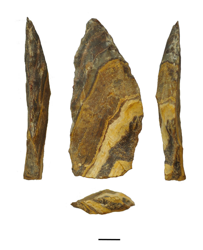 Different angles of an estimated 500,000-year-old stone point from South Africa’s Northern Cape. The scale bar at bottom is 1 centimeter long.