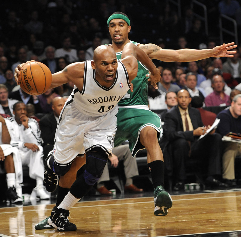 Jerry Stackhouse of the Brooklyn Nets drives past Courtney Lee of the Celtics in the first half Thursday night.