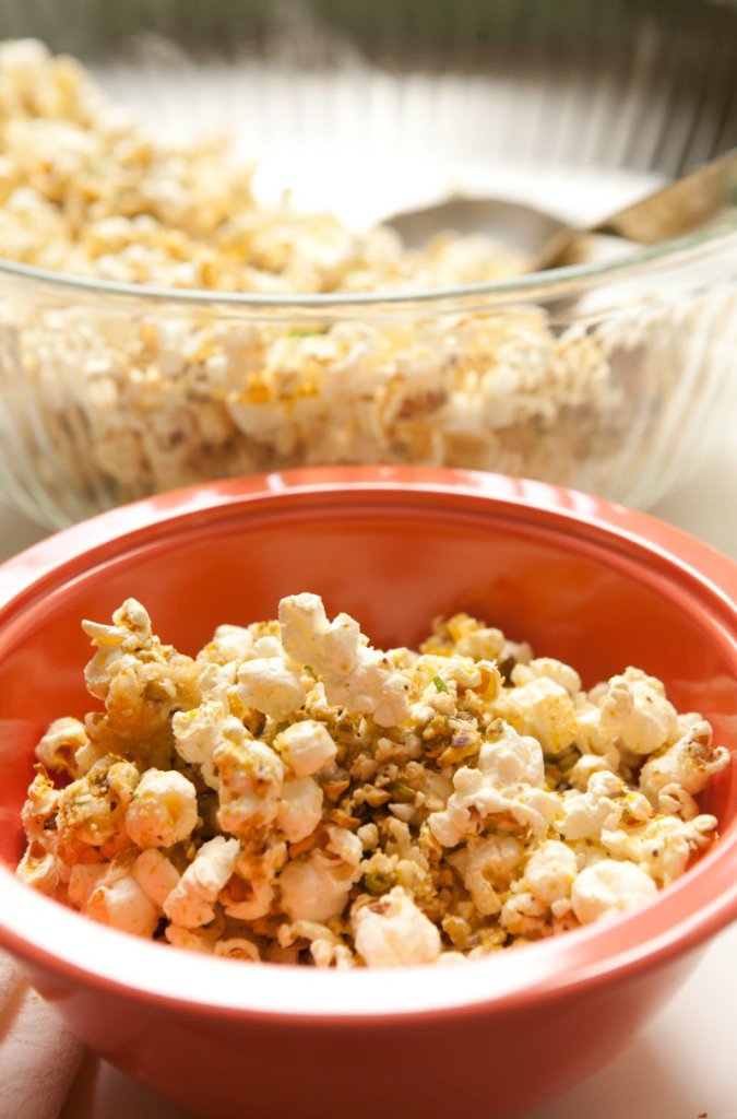 Popcorn is a centuries-old simple food that has gone gourmet. Nutty-cheese popcorn features Parmesan, pistachios and cashews.