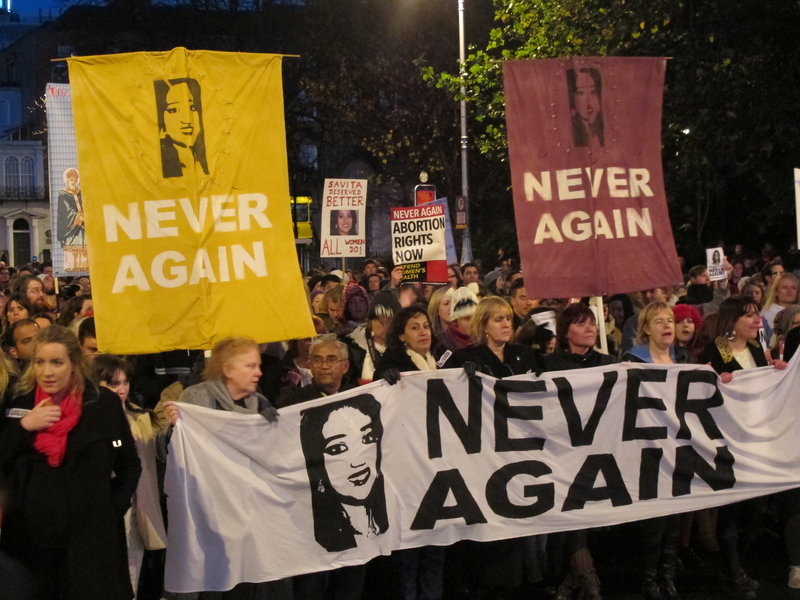 Protesters bearing images of Savita Halappanavar march through Dublin on Saturday to demand that Ireland ensure that abortions can be performed to save a woman’s life.