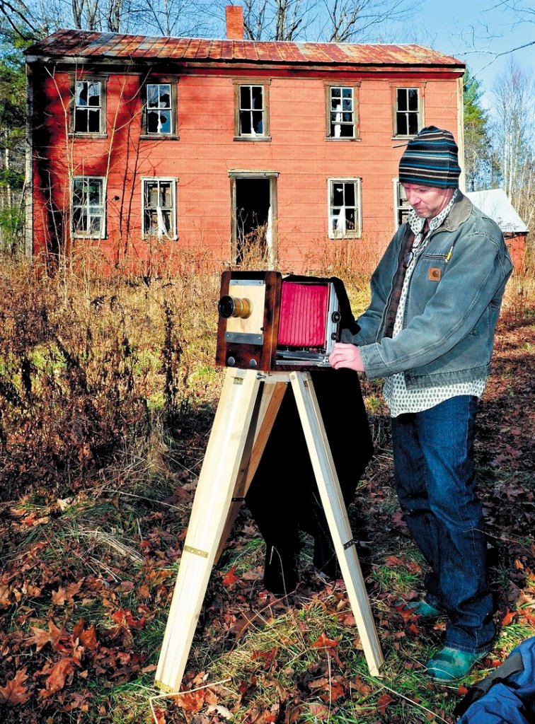 Scott Anton prepares his view camera that uses glass plate negatives to photograph the John Wentworth home in Athens that was built in 1800.