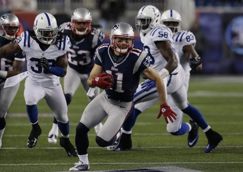Julian Edelman, playing perhaps his finest game as a Patriot, scoots down the sideline for good yardage during first-half action of Sunday’s victory over Indianapolis.