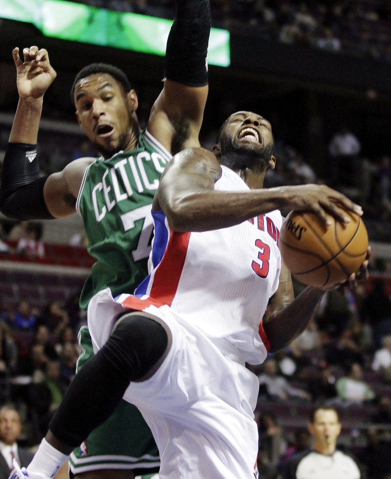 Pistons guard Rodney Stuckey is fouled by Boston forward Jared Sullinger while going to the basket in the second half Detroit’s 103-83 victory Sunday night.