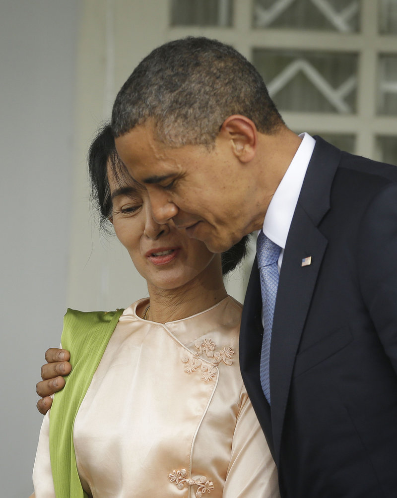 President Obama walks Monday with Myanmar opposition leader Aung Sun Suu Kyi at Suu Kyi’s residence in Myanmar.