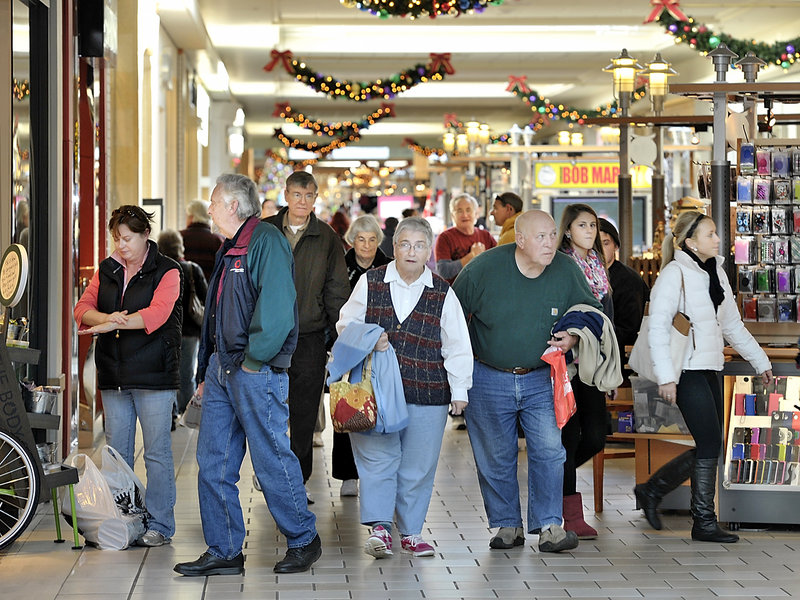 Shoppers stroll the corridors of the Maine Mall on Tuesday, beating Black Friday crowds and taking advantage of the fact that retailers are holding sales earlier in the season, including events tied to Veterans Day.