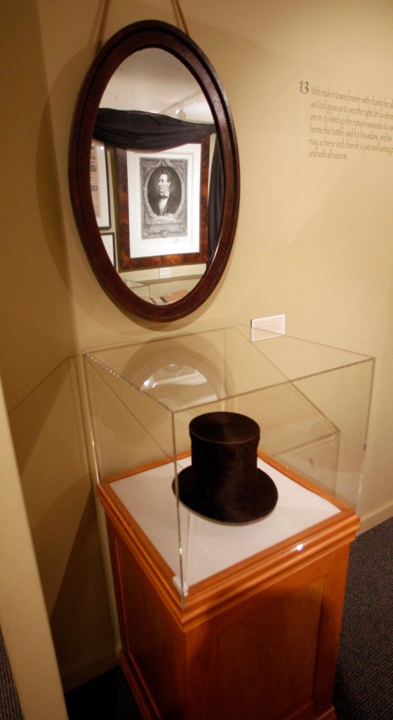 This Monday, Nov. 19, 2012 photo shows a stove pipe hat and mirror used by Abraham Lincoln is seen at the Robert Todd Lincoln mansion Hildene in Manchester, Vt. The Georgian Revival home was built in 1905 by Robert Todd Lincoln, the only one of the president's four children to survive to adulthood. (AP Photo/Toby Talbot)