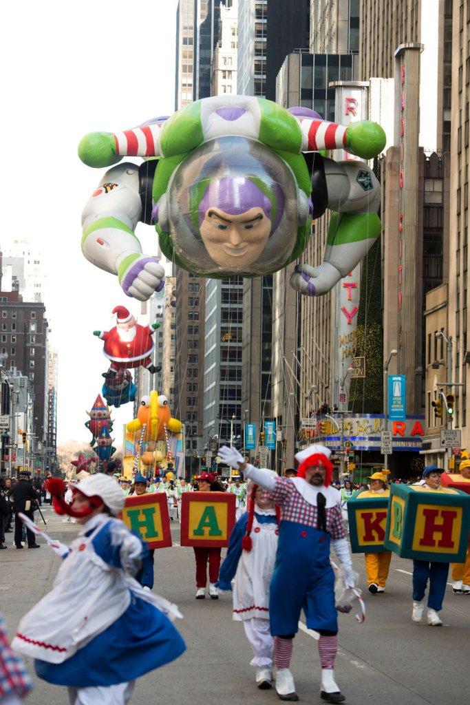 The Buzz Lightyear balloon floats in the Macy’s Thanksgiving Day Parade in New York on Thursday. Meanwhile, Mayor Michael Bloomberg’s office was coordinating the distribution of 26,500 meals at 30 sites in neighborhoods affected by Superstorm Sandy.