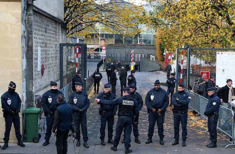 French police officers take their positions at one of the main entrances of the courthouse in Bordeaux after former French President Nicolas Sarkozy’s arrival Thursday.