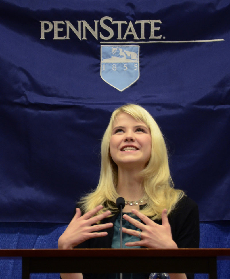 Elizabeth Smart speaks to reporters at the Child Sexual Abuse Conference in State College, Pa., in October. Smart, who was abducted in 2002 and held prisoner for nine months, is working on her account of the experience.