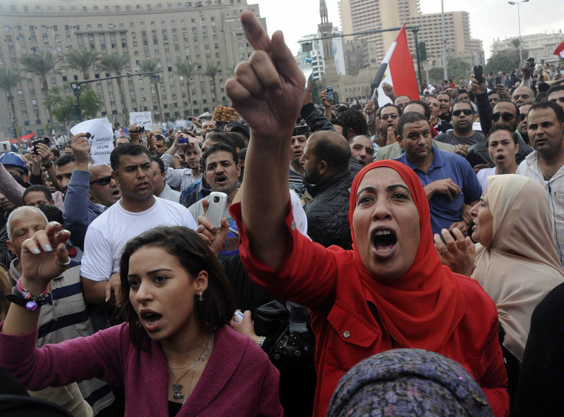 Protesters opposed to President Mohammed Morsi chant slogans in Tahrir Square in Cairo on Friday.