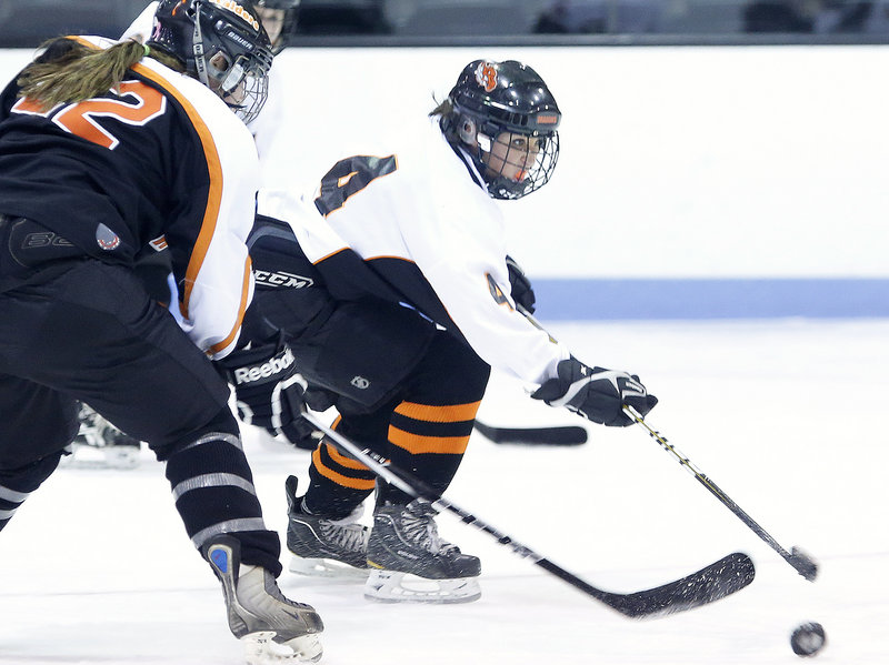 Eliza Brooks of Brunswick gets off a shot ahead of Alexis LaChance of Winslow during Winslow’s 4-3 victory Friday night.