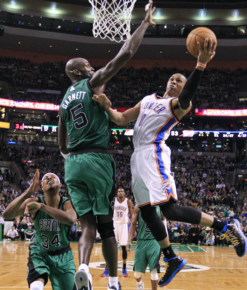 Kevin Garnett, Celtics center, defends against Russell Westbrook during Friday’s 108-100 victory over Oklahoma City in Boston.