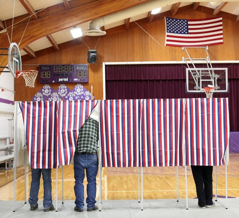 Voters cast their ballots Nov. 6 in Harrison, Mont. For the first time since 1952, a presidential candidate whom men chose decisively lost. Women stuck with President Obama’s social safety net versus the rugged individualism of Mitt Romney.