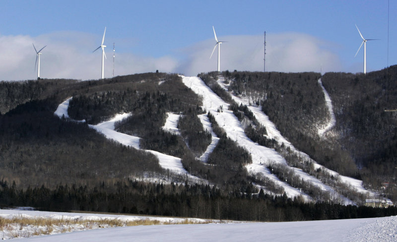 Windmills dot Mars Hills Mountain in Mars Hill. Maine wind developers are working with snowmobilers’ groups to make their sites, but not properties, destinations for sledders.