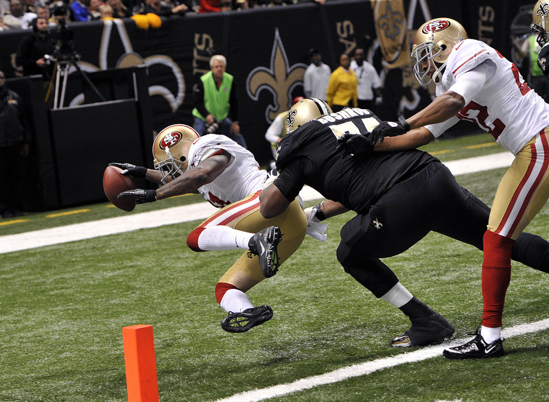 San Francisco safety Donte Whitner scores after a 42-yard interception return, giving the 49ers a 28-14 lead over the New Orleans Saints. The 49ers returned two Drew Brees interceptions for touchdowns.