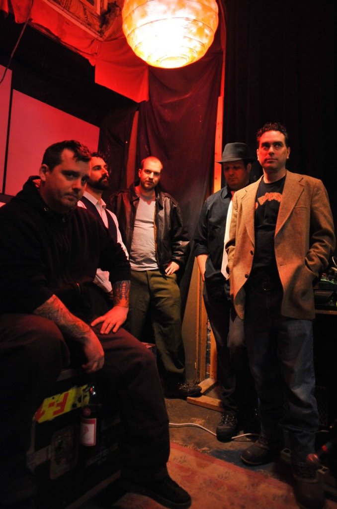 Johnny Cremains includes vocalist and theramin player Sean Libby, piano and organ player Erik Winter, drummer Michael Anderson, guitarist Doug Porter and bass player David Joy.