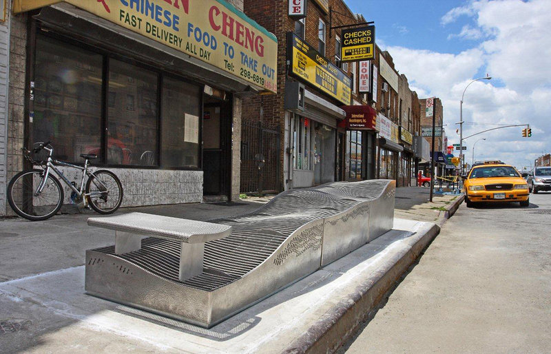 A raised ventilation grate doubles as street furniture installed to limit subway flooding from rain on Hillside Avenue in the Queens borough of New York. The raised grates were designed to deal with flooding from rain, not the deluge generated by Superstorm Sandy.