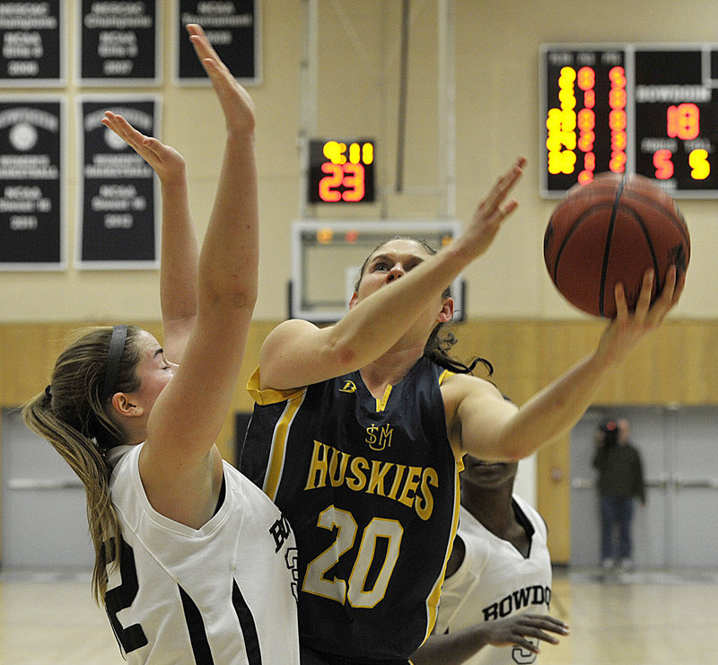 Rebecca Knight, who scored 25 points for USM, including 21 in the second half, puts up a shot over Megan Phelps of Bowdoin.