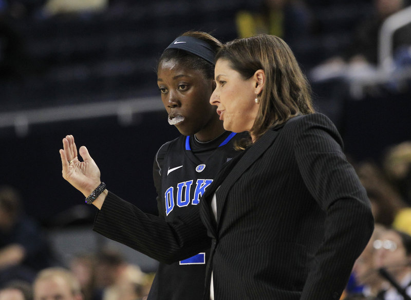 Duke Coach Joanne P. McCallie talks with guard Alexis Jones during Wednesday’s game against Michigan at Ann Arbor, Mich. Duke improved to 5-0 with a 71-54 win.