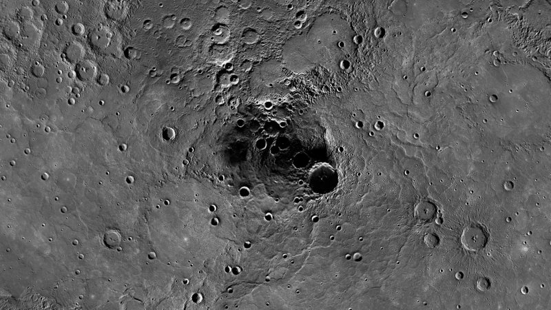 Photo shows a 68-mile-diameter crater in the north polar region of Mercury which has been shown to harbor ice.
