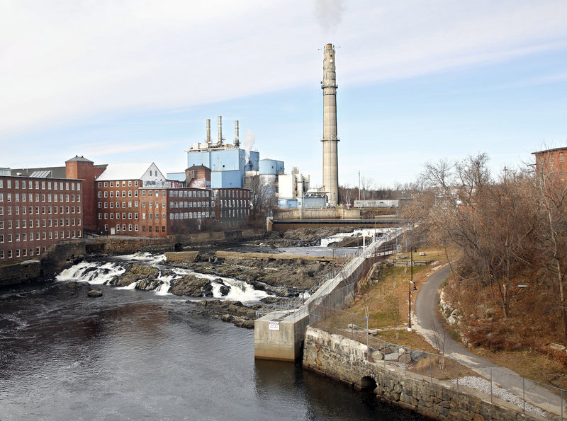 Biddeford purchased the Maine Energy Recovery Co. property Friday, sealing a historic deal that many hope will bring new life to a downtown dominated by a trash incinerator for the past 25 years