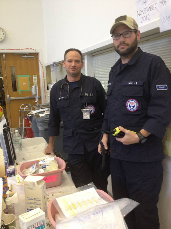 Steve Moody, left, and Joshua Frances are among 12 Mainers who have been providing medical care to about 200 victims of Hurricane Sandy. “It’s been an eye-opening, awesome experience,” said Moody, a nurse at Maine Medical Center.