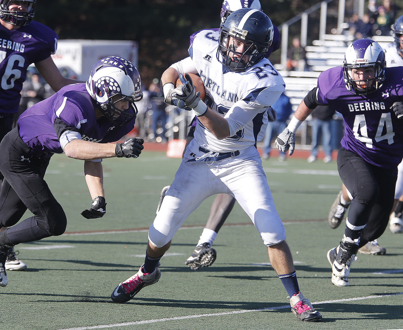 Nick Volger, playing his final game for Portland, attempts to elude a tackler at Fitzpatrick Stadium. Deering won for the 10th time in the last 11 games.