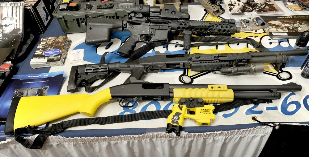 Thursday, Feb.2, 2012. A Taser X-12 at bottom among conventional shotguns above on display as the Maine Chiefs of Police Association winter meeting and trade show in South Portland.