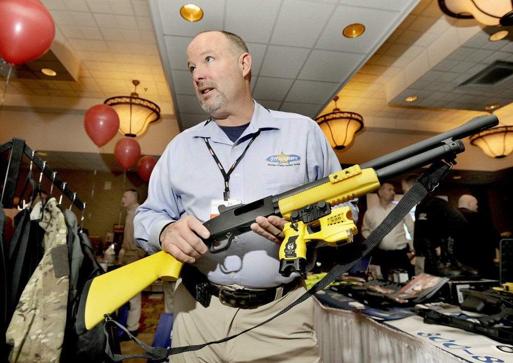 Thursday, Feb.2, 2012. Jay Kehoe demonstrates a new non-lethal weapon called a Taser X-12 at the Maine Chiefs of Police Association winter meeting and trade show in South Portland.