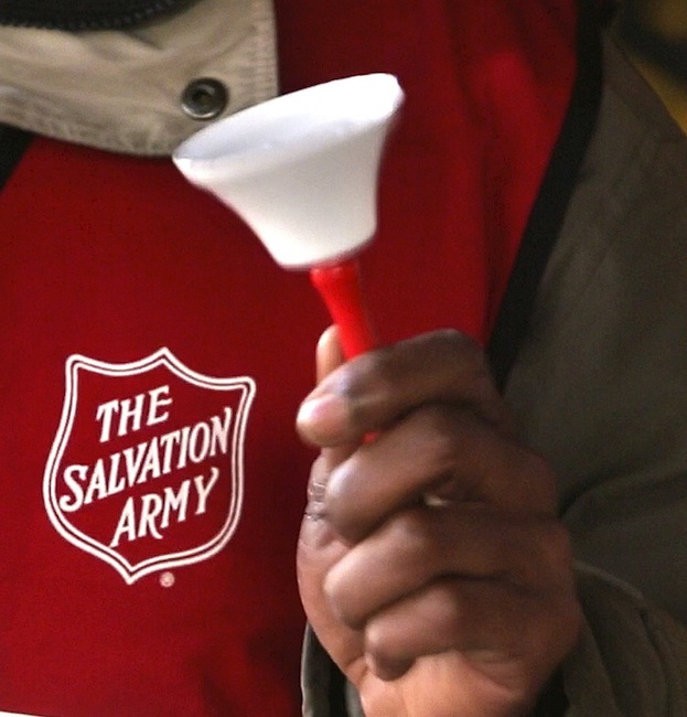 Danny Mitchell rings the bell at a Salvation Army donation kettle at Cabela's in Scarborough on Wednesday, November 21, 2012. Organizations like the Salvation Army rely on people being in a giving mood during the holiday season, but the Salvation Army is struggling this year to meet their goals.