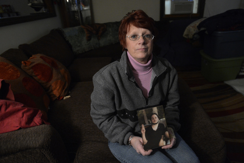 Sharon O’Brien holds a family photo of her nephew, Andrew Landry, at the family’s home in Sanford last week. O’Brien, who was with Landry the night he was shot and killed by police in Lyman in January 2011, says she believes her nephew reacted after being put on the defensive.
