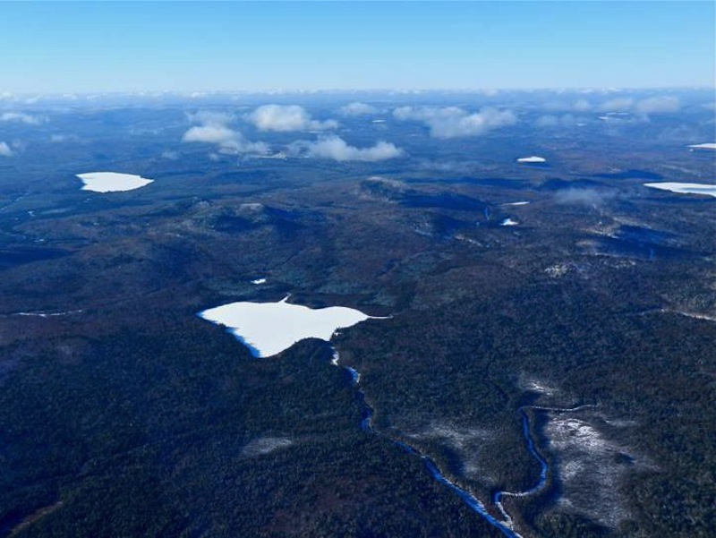 Bald Mountain, with Greenlaw Pond in the foreground, is the site of mineral deposits that Irving, which owns the property, would like to mine. 
