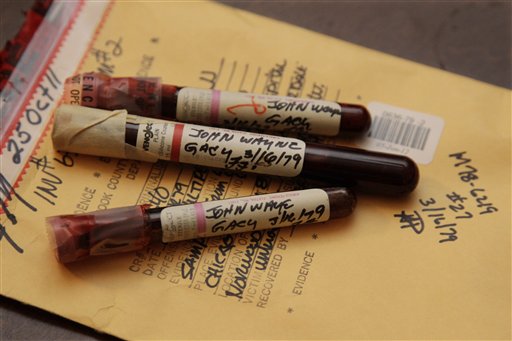 This photo taken Friday, Nov. 30, 2012, in Chicago shows three vials of mass murderer John Wayne Gacy's blood recently discovered by Cook County Sheriff's detective Jason Moran. The sheriff�s office is creating DNA profiles from the blood of Gacy and other executed killers and putting them in a national DNA database of profiles created from blood, semen, or strands of hair found at crime scenes and on the bodies of victims. What they hope to find is evidence that links the long-dead killers to the coldest of cold cases and prompt authorities in other states to submit the DNA of their own executed inmates and maybe evidence from decades-old crime scenes to help them solve their own cases. (AP Photo/M. Spencer Green)