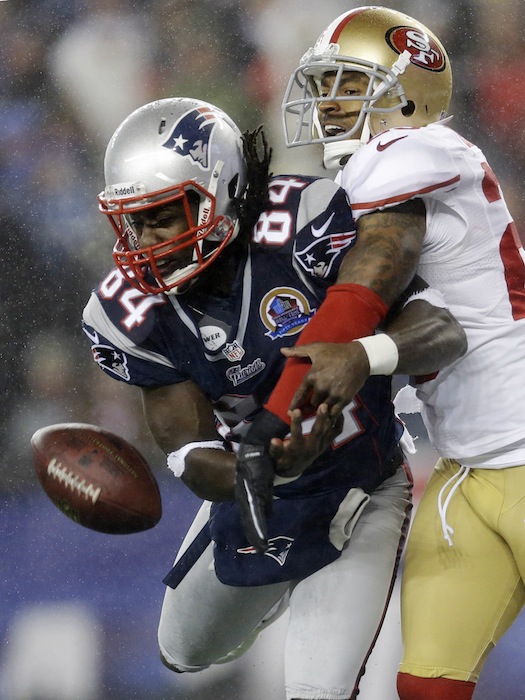 San Francisco 49ers cornerback Tarell Brown, right, breaks up a pass in the end zone intended for New England Patriots wide receiver Deion Branch (84) in the second quarter of an NFL football game in Foxborough, Mass., Sunday, Dec. 16, 2012. (AP Photo/Elise Amendola) NFLACTION12; Gillete Stadium