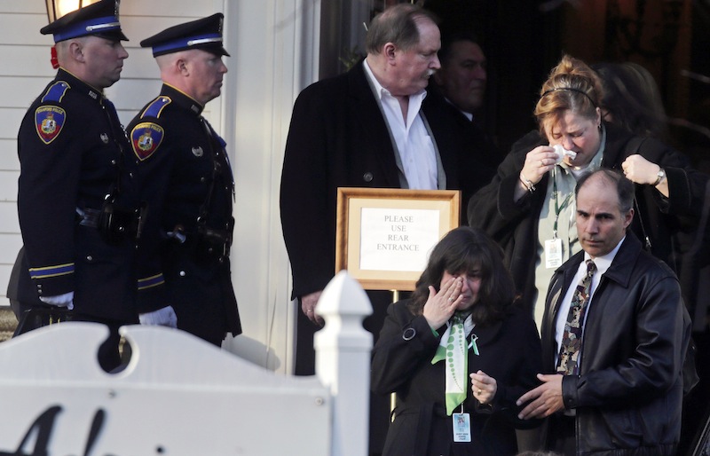 Family and friends react after attending the wake of school shooting victim Victoria Soto, a teacher at Sandy Hook Elementary School, in Stratford, Conn., Tuesday, Dec. 18, 2012. Soto, 27, was killed when Adam Lanza walked into Sandy Hook Elementary School in Newtown, Conn., Dec. 14, and opened fire, killing 26 people, including 20 children, before killing himself. (AP Photo/Charles Krupa)