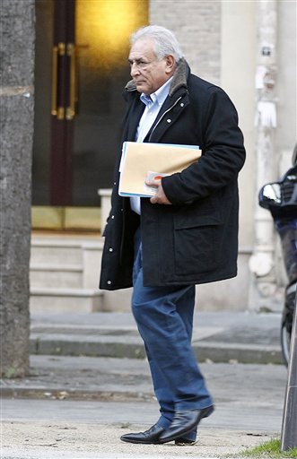 Former International Monetary Fund leader Dominique Strauss-Kahn leaves his apartment building in Paris on Monday.