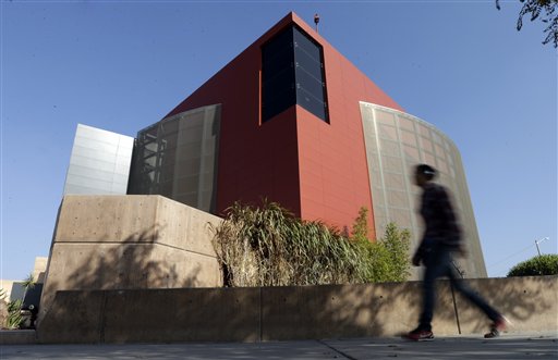 A man walks past an expansion of the Tijuana Cultural Center known as "The Cube," designed by architect Eugenio Velazquez, in Tijuana, Mexico, recently.