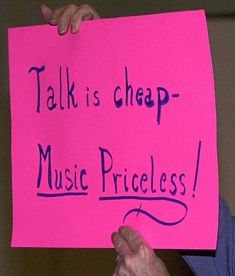 A sign protesting a Maine Public Broadcasting music-program cutback in 2001 expresses the feelings of some readers about the radio network's newly announced changes in programming.