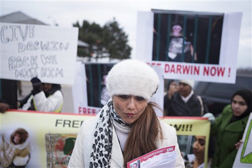 Yasmin Nakhuda stands with supporters outside an Animal Services offices in Toronto on Wednesday to rally support for the return of her monkey, "Darwin."
