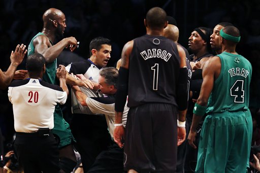 Boston Celtics' Kevin Garnett, far left, and Brooklyn Nets forward Gerald Wallace, third from right, are separated by officials in the second half of their NBA basketball game at Barclays Center Tuesday in New York. Boston won 93-76.