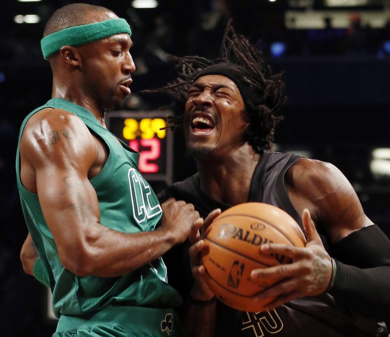 Gerald Wallace of the Brooklyn Nets charges into Jason Terry of the Boston Celtics during the first half of their Christmas game Tuesday. Boston beat the Nets for the first time in three meetings this season, 93-76.