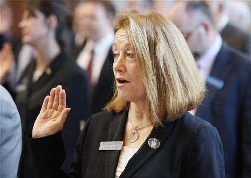 Rep. Kathleen Chase, of Wells, is sworn in Wednesday at the State House in Augusta.