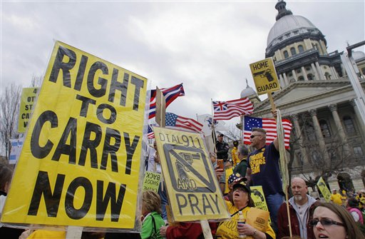 In this March 7, 2012, photo, gun owners and supporters participate in an Illinois Gun Owners Lobby Day rally at the Illinois State Capitol in Springfield.