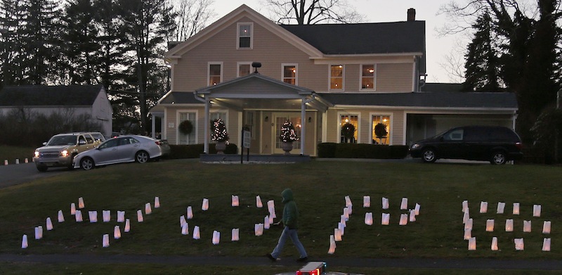 The word "HOPE" is illuminated on the front lawn of a funeral home hosting the wake of Sandy Hook Elementary School principal Dawn Lafferty Hochsprung in Woodbury, Conn., Wednesday, Dec. 19, 2012. Hochsprung was killed when Adam Lanza walked into Sandy Hook Elementary School in Newtown, Conn., Dec. 14, and opened fire, killing 26 people, including 20 children, before killing himself. (AP Photo/Charles Krupa)