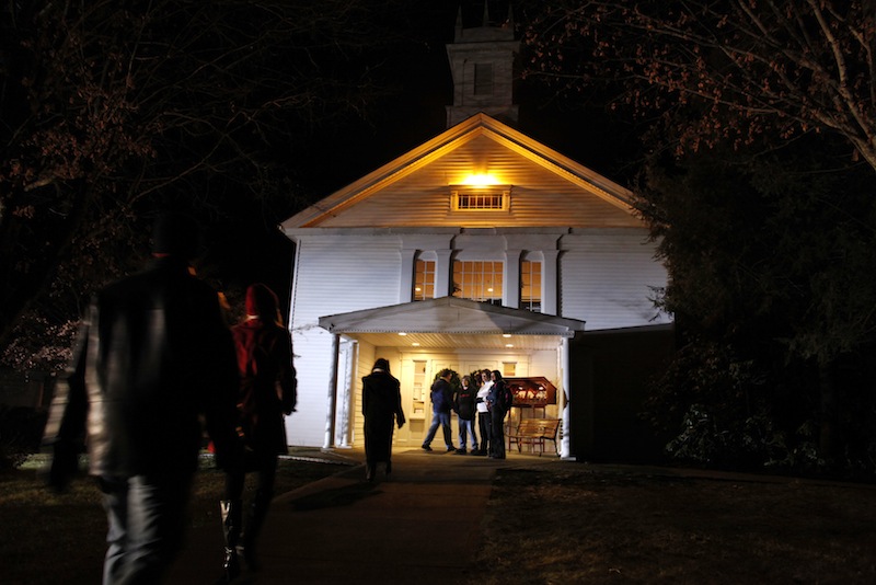People arrive for a prayer service at Newtown United Methodist Church in the aftermath of a mass shooting at nearby Sandy Hook Elementary School, Friday, Dec. 14, 2012 in Newtown, Conn. A gunman walked into the school Friday and opened fire, killing 26 people, including 20 children. (AP Photo/Jason DeCrow)