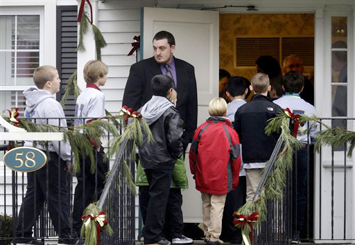 Mourners arrive at the funeral service for 6-year-old Jack Pinto on Monday, in Newtown, Conn. Pinto was one of the 26 people killed when Adam Lanza walked into Sandy Hook Elementary School and opened fire on Friday.