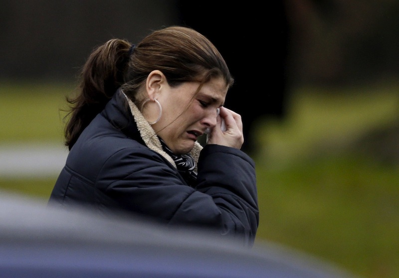 A mourner leaves the funeral service of Sandy Hook Elementary School shooting victim, Jack Pinto, 6, Monday, Dec. 17, 2012, in Newtown, Conn. Pinto was killed when a gunman walked into Sandy Hook Elementary School in Newtown Friday and opened fire, killing 26 people, including 20 children. (AP Photo/David Goldman)
