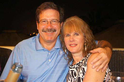 In an undated image provided by Mark Sherlach, Sherlach and his wife, school psychologist Mary Sherlach, pose for a photo. Mary Sherlach was killed Friday when she and principal Dawn Hochsprung, below, confronted a gunman who opened fire at Sandy Hook Elementary School in Newtown, Conn., killing 26 people.