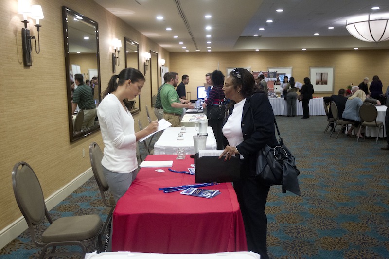 In this Friday, Nov. 30, 2012 photo, a person fills out an application at the Fort Lauderdale Career Fair, in Dania Beach, Fla. The U.S. economy added a solid 146,000 jobs in November and the unemployment rate fell to 7.7 percent, the lowest since December 2008, the Labor Department announced Friday, Dec. 7, 2012. The government said Superstorm Sandy had only a minimal effect on the figures. (AP Photo/J Pat Carter)