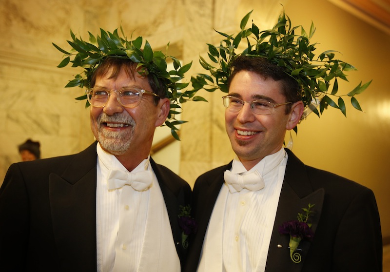 Steven Jones, left, and Jamous Lizotte wear laurel wreaths as they arrive at City Hall to obtain a marriage license, Friday, Dec. 28, 2012, in Portland, Maine. Same-sex couples in Maine will be allowed to marry as a new law goes into effect at 12:01 AM Saturday, Dec. 29, 2012.(AP Photo/Robert F. Bukaty)